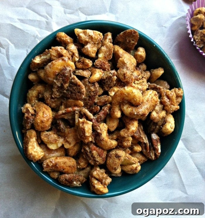 Sugar & Spice Nut Medley 4 A tastefully arranged serving of Sweet and Spicy Nut Mix in a small ceramic bowl, ready to be enjoyed at a gathering.