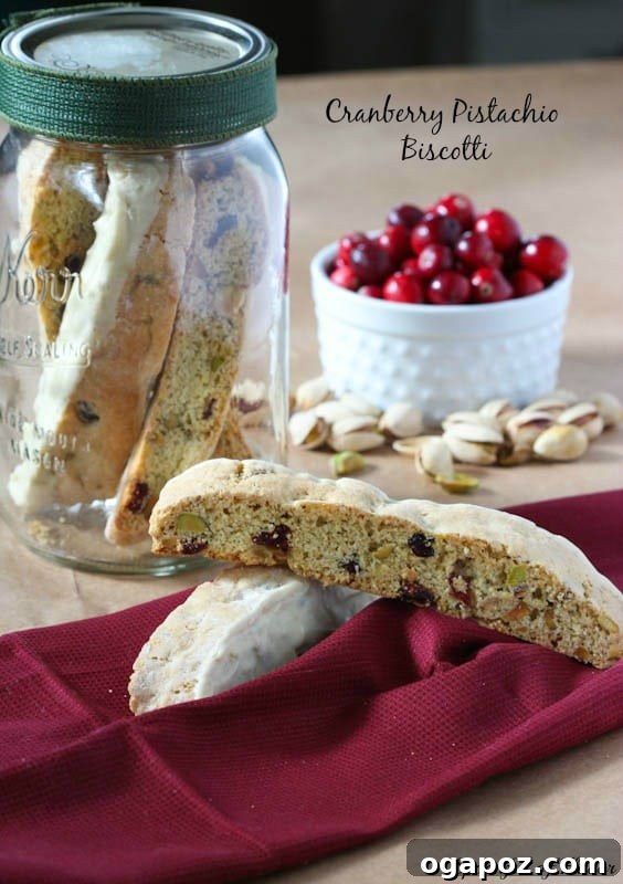 26 Must-Try Holiday Delights 6 Festive Cranberry Pistachio Biscotti, beautifully arranged and perfect for dipping in coffee or tea during the holiday season.
