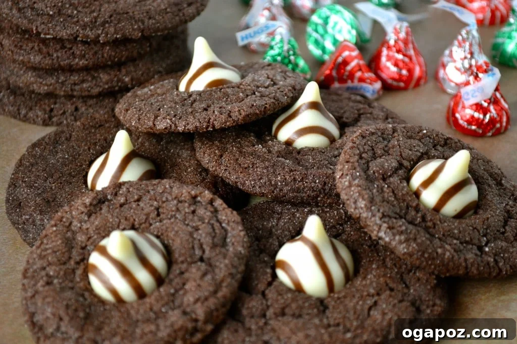 26 Must-Try Holiday Delights 8 A festive platter showcasing an array of delicious holiday treats, including Chewy Chocolate Cookies with Hershey's Hugs, perfect for sharing.
