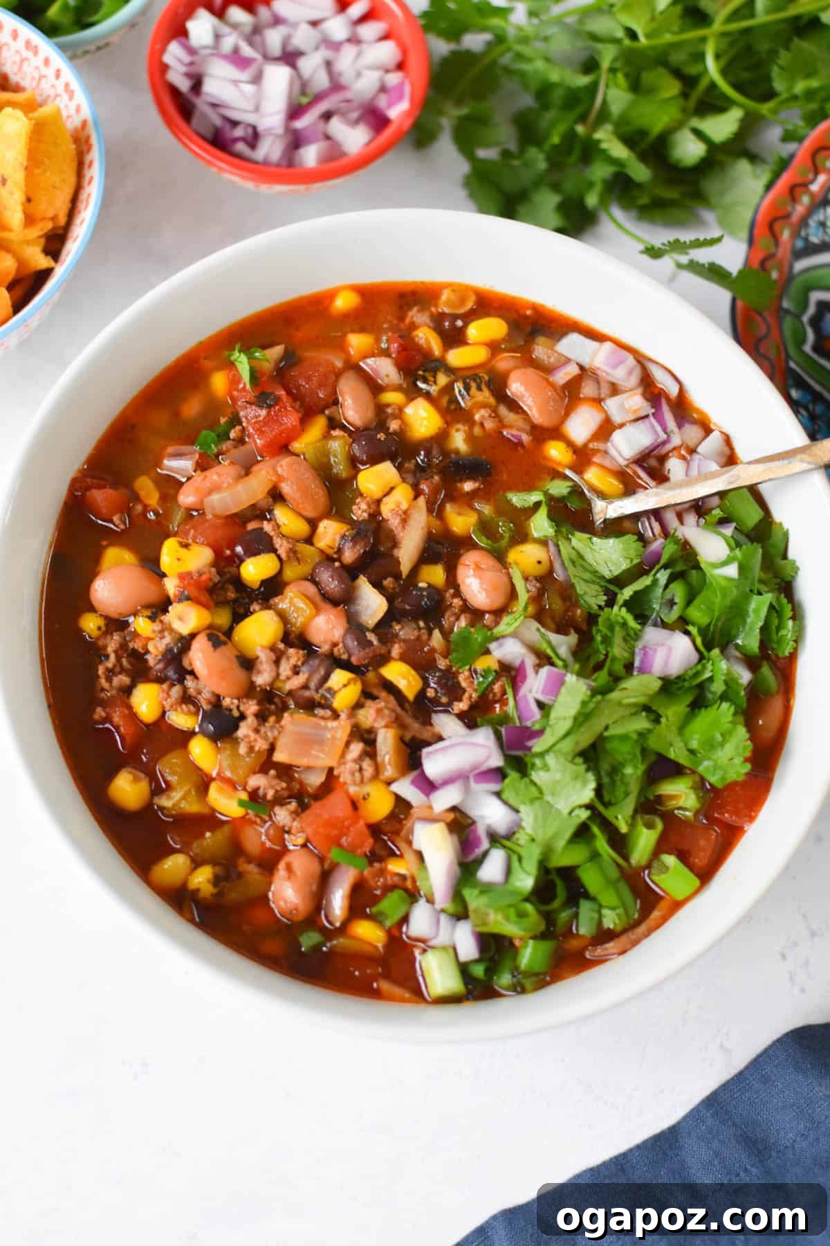 Hearty Crockpot Taco Soup 3 Slow Cooker Taco Soup Recipe in a white bowl, ready to be served