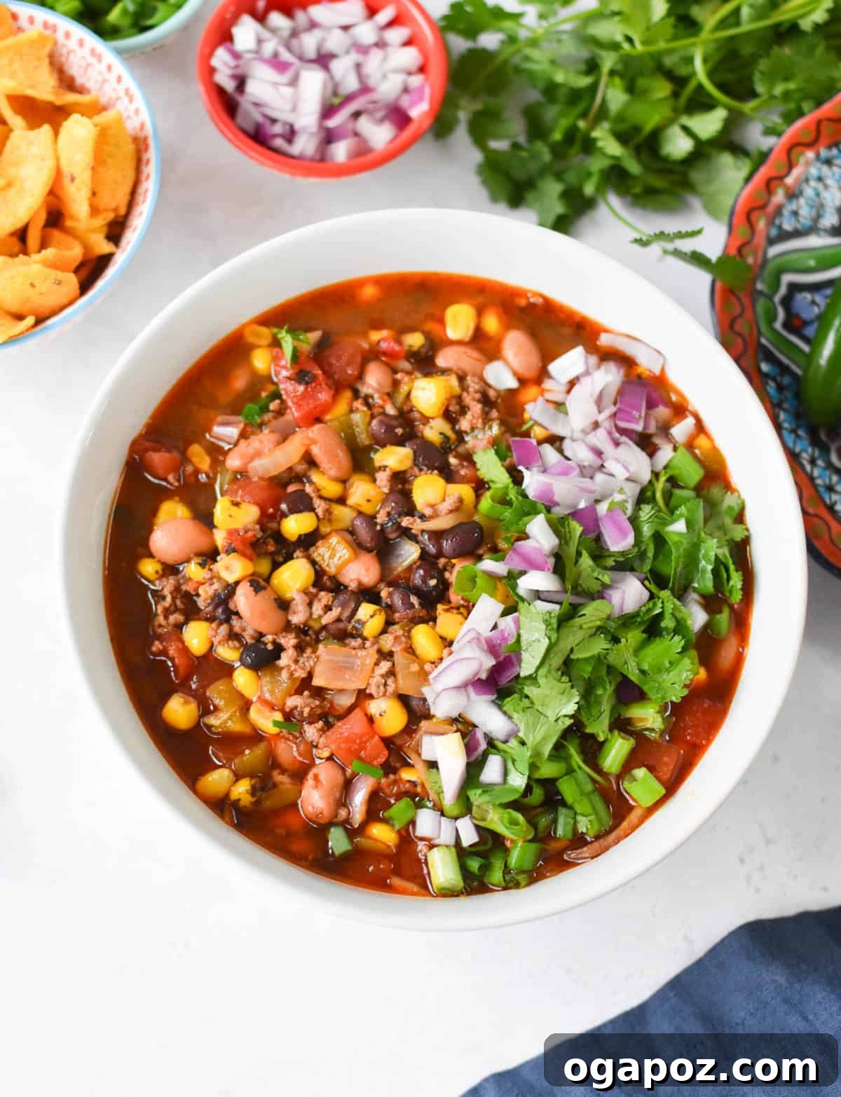 Hearty Crockpot Taco Soup 9 Slow Cooker Taco Soup Recipe in a white bowl with fresh toppings
