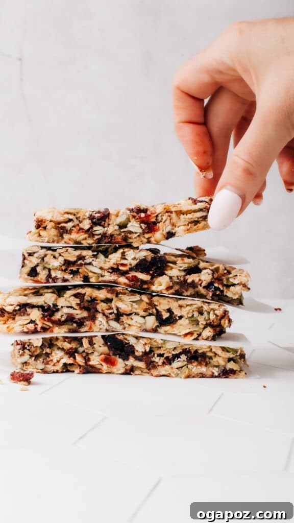 Simply Delicious Wholesome Granola Bars 2 Delicious and healthy homemade chewy granola bars stacked on a plate.
