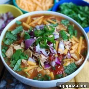 Slow Cooker Chicken Tortilla Soup in a bowl with toppings