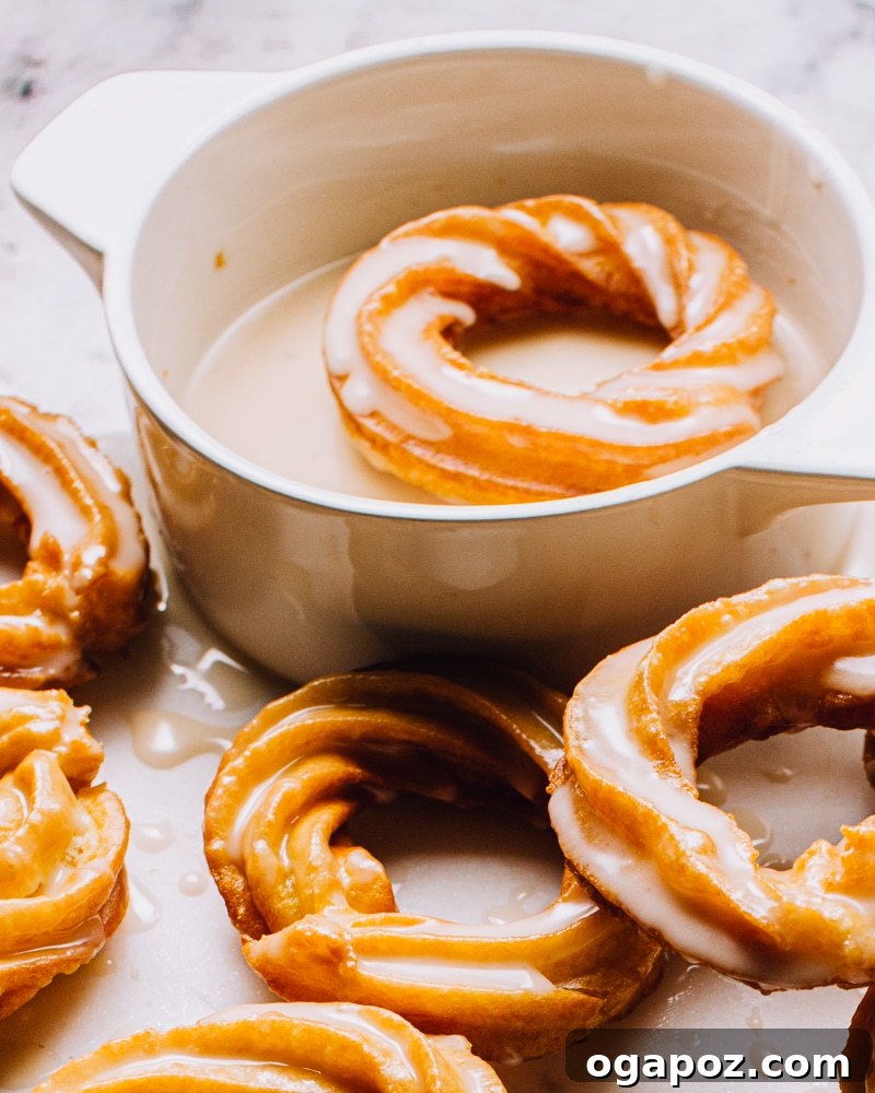 Airy French Delights 15 Fried French Crullers cooling on a wire rack, ready for their delicious glaze.
