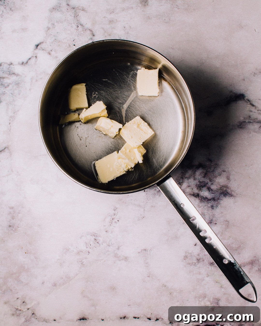 Airy French Delights 5 Water, butter, sugar, and salt simmering in a saucepan for French Cruller dough.