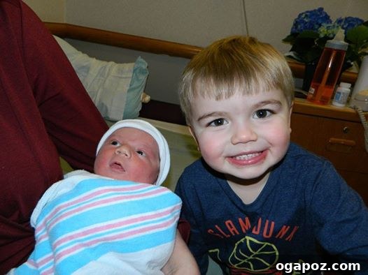 Unveiling Andrew 7 Big brother Will gently touching baby Andrew's head with care