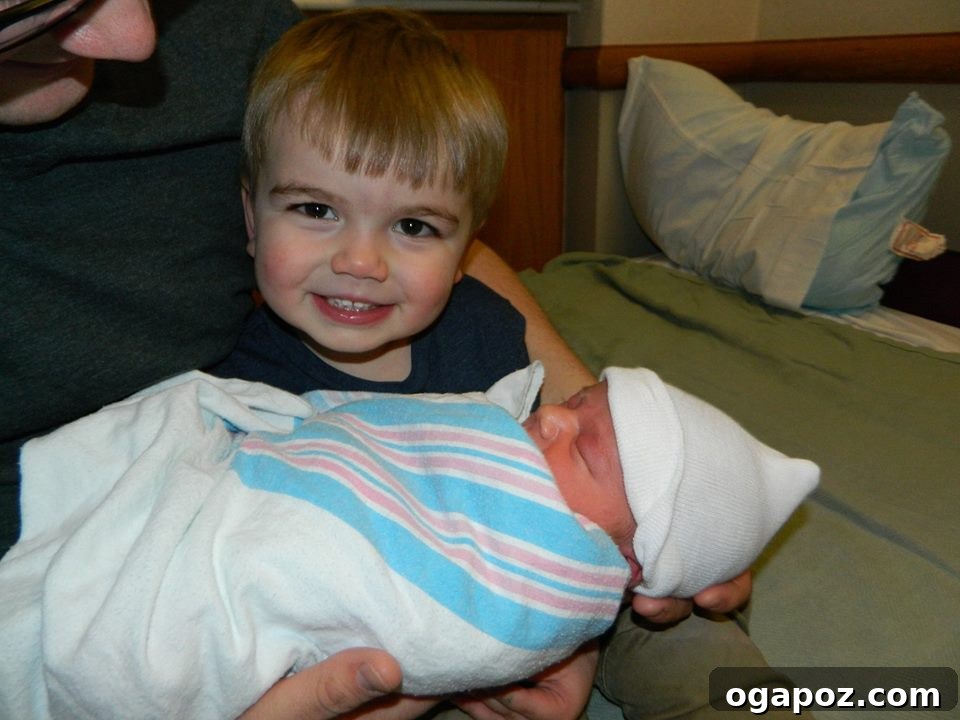 Unveiling Andrew 9 Family photo with parents, big brother Will, and newborn baby Andrew