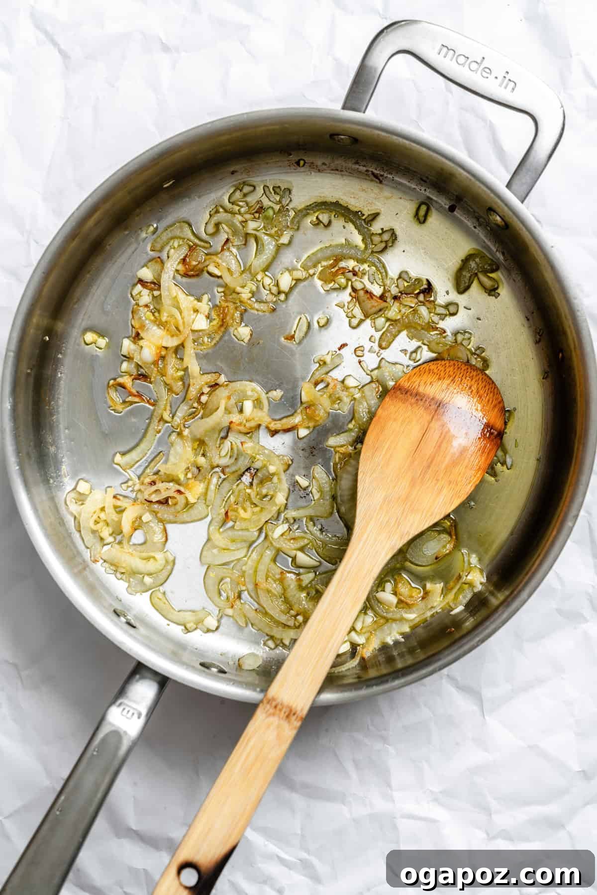 Lebanese Braised Green Beans 5 Onion and garlic sautéed in a pan for Lebanese Green Beans