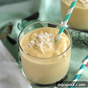 Close-up of a beautifully blended Coconut Mango Smoothie, ready to be served in a stylish glass.