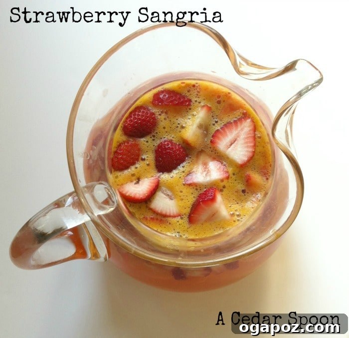 Refreshing Strawberry Sangria 2 Vibrant Strawberry Sangria in a pitcher with fresh fruit