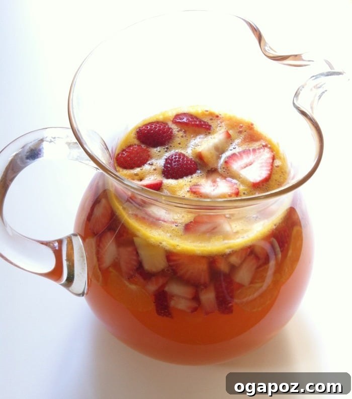 Refreshing Strawberry Sangria 4 Pitcher and glasses of homemade Strawberry Sangria