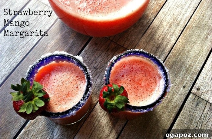 Strawberry Mango Sunset Margarita 2 Vibrant Strawberry Mango Margarita ready to be served on a summer day