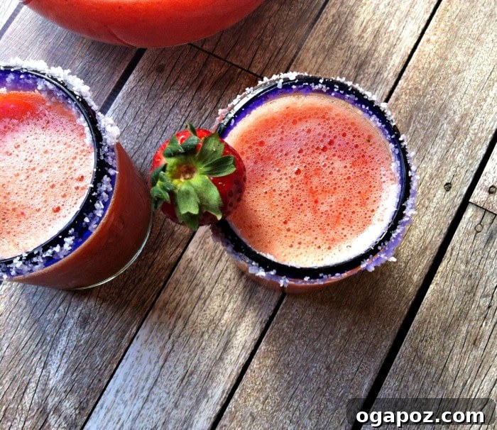 Strawberry Mango Sunset Margarita 3 Close-up of a Strawberry Mango Margarita with fresh fruit