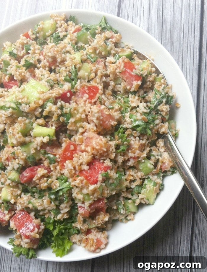 Vibrant Bulgur Salad with Cool Mint Yogurt Dressing 4 Close-up of Vegetable Bulgur Salad with a spoon, highlighting its texture and fresh ingredients