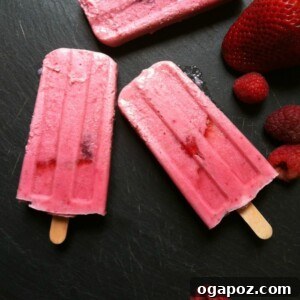 Finished Strawberry Raspberry Cream Pops with a perfect blend of red and white, ready to be enjoyed.