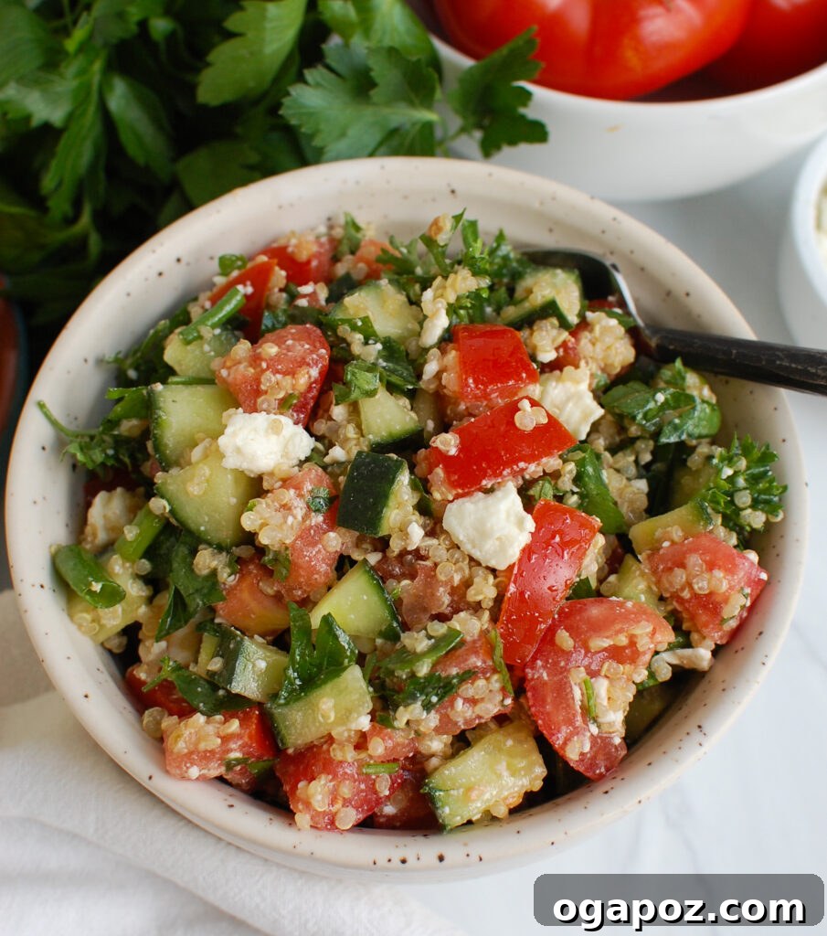 Feta Quinoa Bowl with Tomato Cucumber 5 A smaller serving of Tomato Cucumber Feta Quinoa Salad in a blue patterned bowl