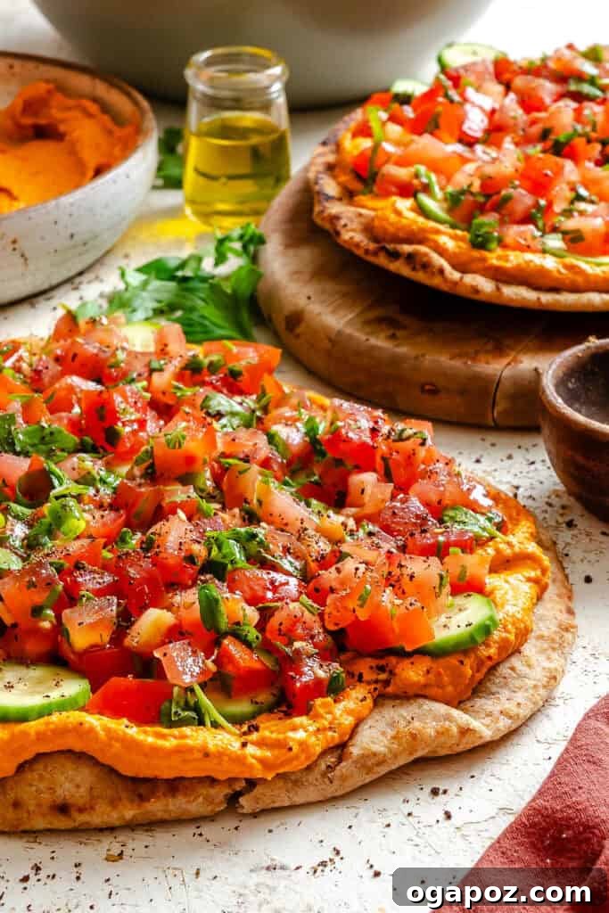 Sun-Kissed Mediterranean Flatbread Pizza 4 A Mediterranean Naan Pizza on a wooden cutting board, garnished with an extra sprinkle of fresh parsley, showing its inviting textures.