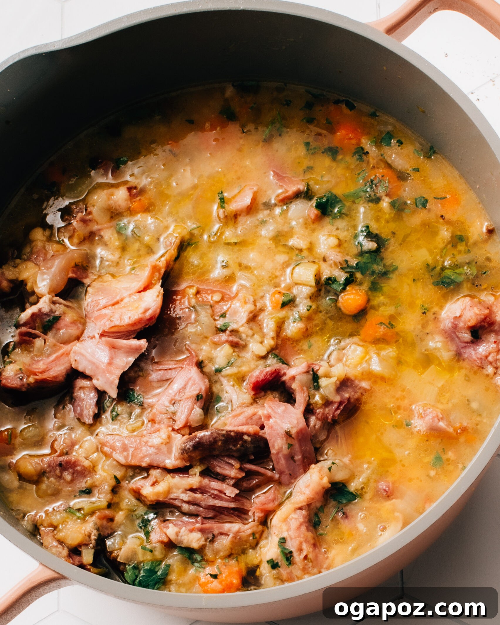 Smoky Ham and Hearty Lentil Soup 5 A large pot filled with freshly made Ham and Lentil Soup, simmering gently on the stovetop, ready to be served.
