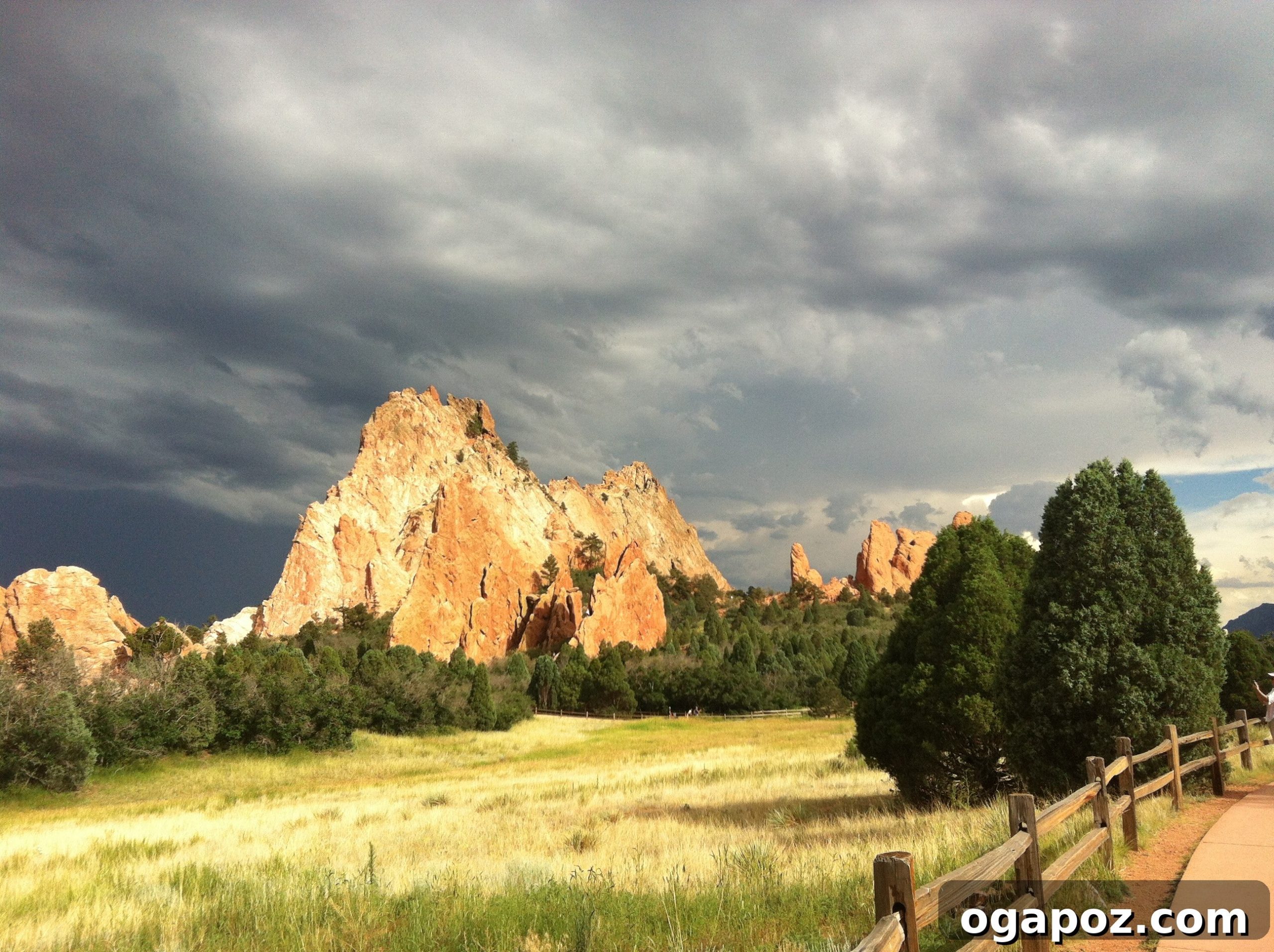 Red rock formations at Garden of the Gods with dramatic storm clouds overhead in Colorado