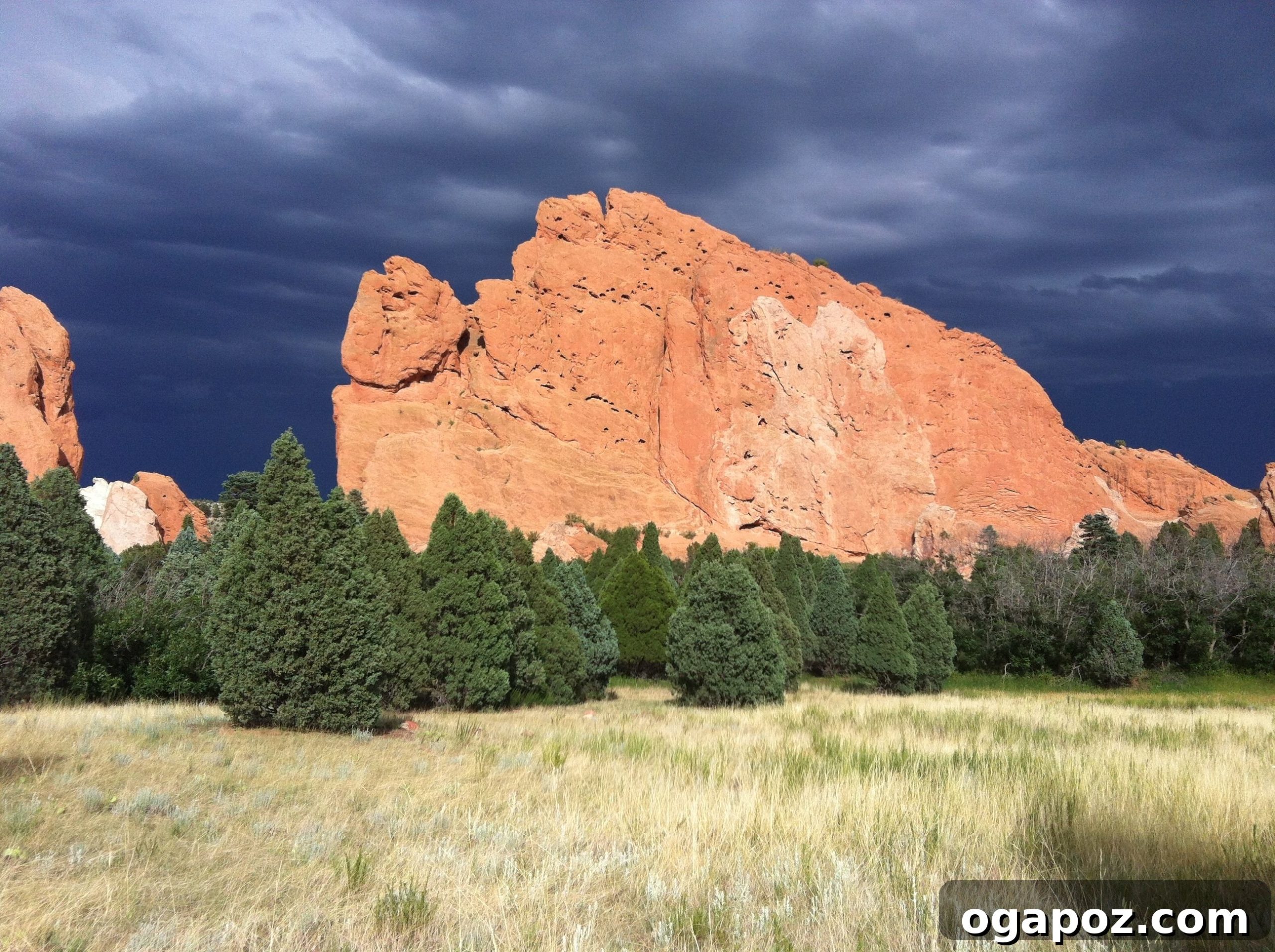 Vibrant red rock cliffs at Garden of the Gods under a stormy Colorado sky