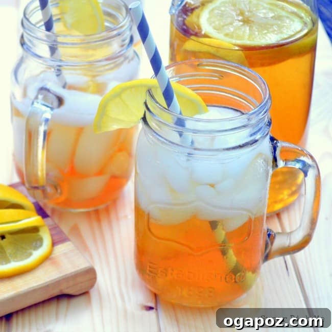 85 Summer Sips to Beat the Heat 12 Sweet Tea Sangria in a pitcher with orange and lemon slices