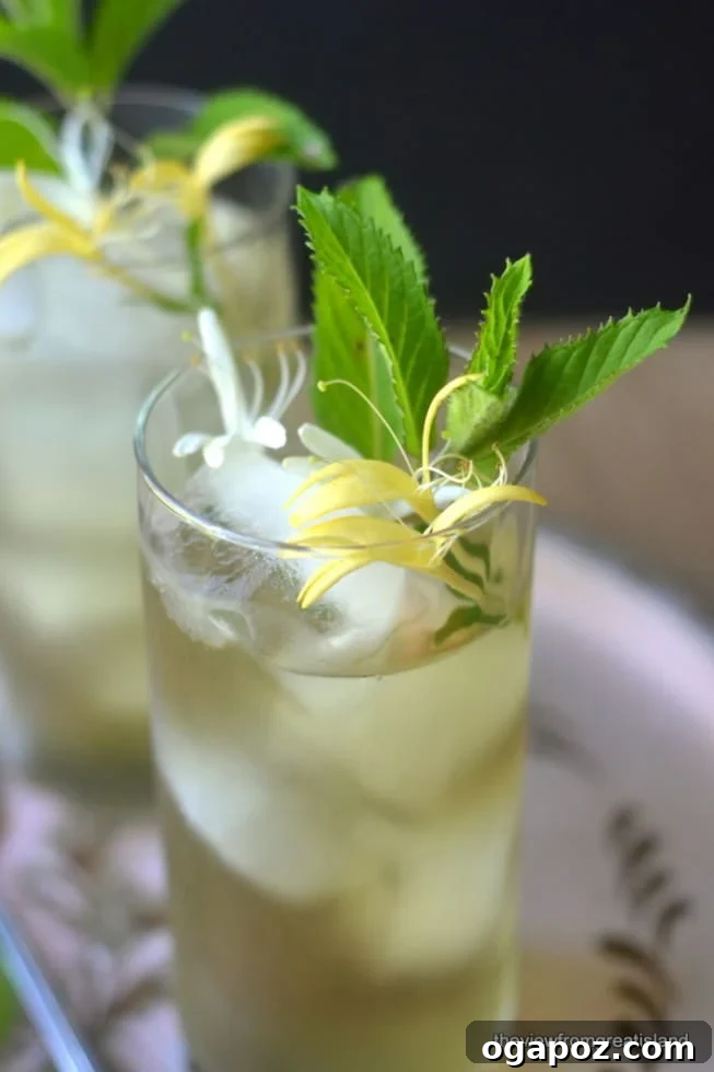 85 Summer Sips to Beat the Heat 3 Honeysuckle Iced Tea served in a glass with a lemon slice