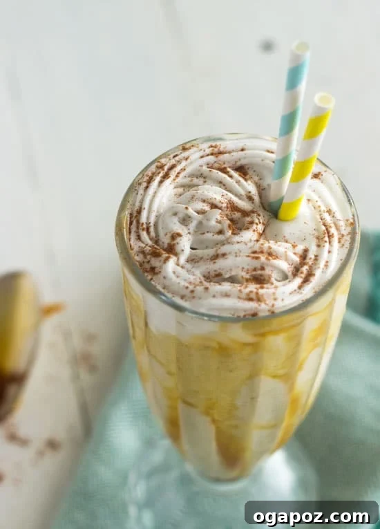 85 Summer Sips to Beat the Heat 5 Banana Foster Smoothie in a glass with a straw