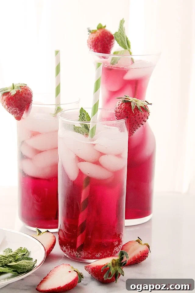 85 Summer Sips to Beat the Heat 6 Hibiscus Iced Tea Sparkler in a glass with lemon and mint