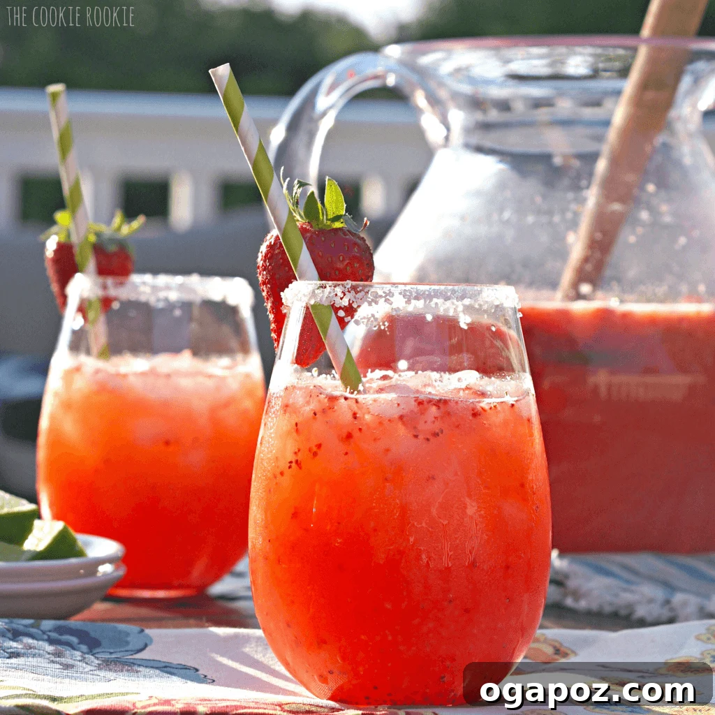 85 Summer Sips to Beat the Heat 8 Strawberry Margarita Punch in a large glass punch bowl