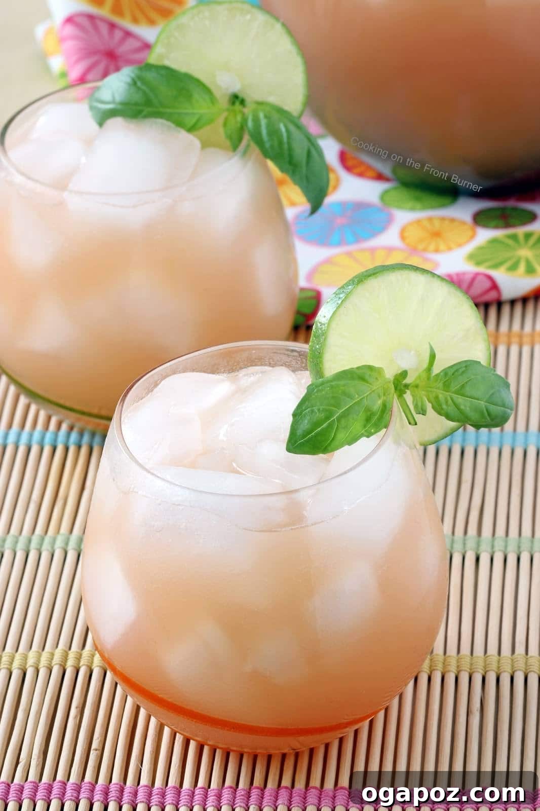 85 Summer Sips to Beat the Heat 10 Grapefruit Lime Basil Cocktail in a glass with a basil garnish