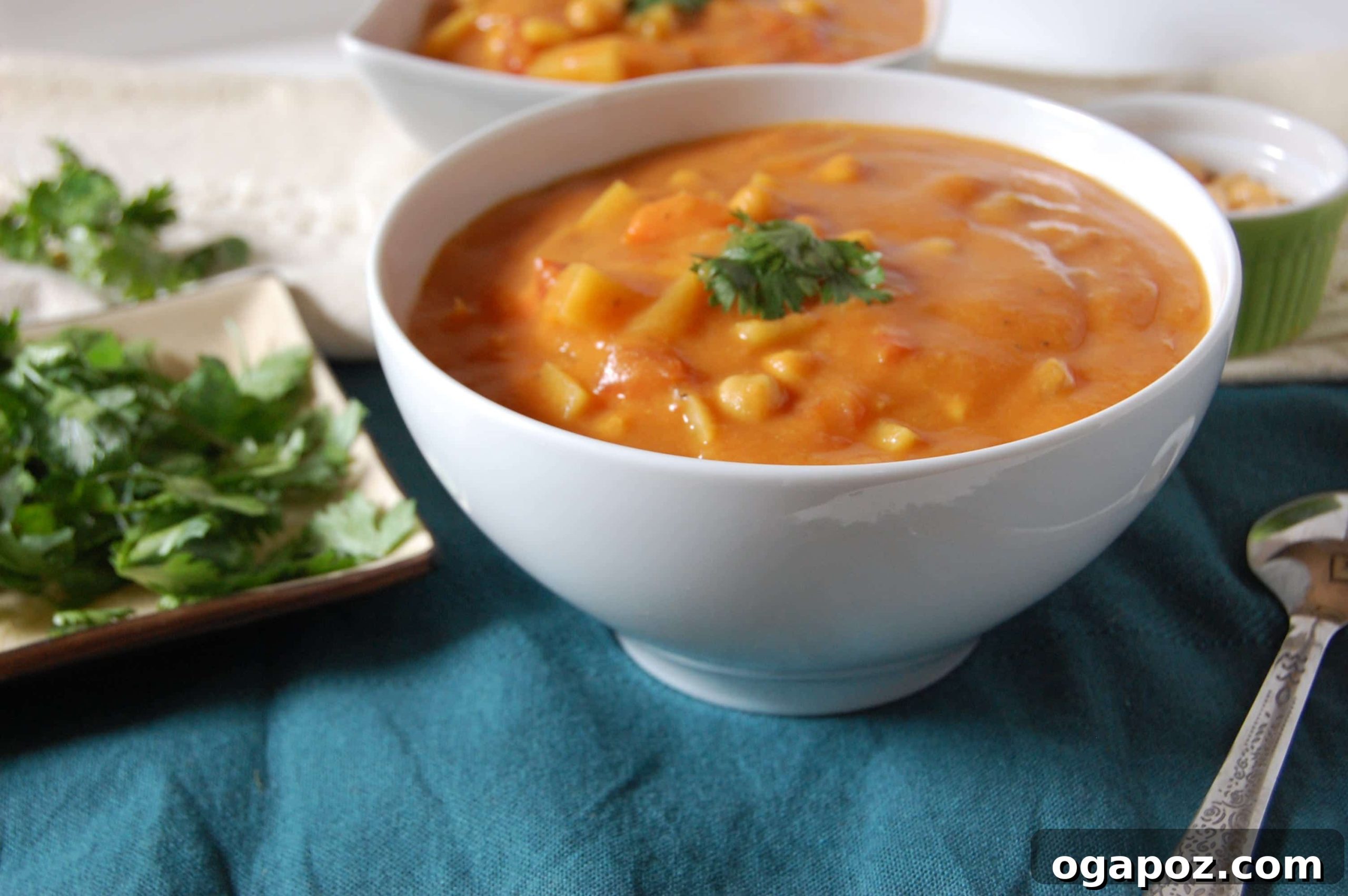 Aromatic Indian Chickpea Vegetable Soup 4 A large pot of Indian Spiced Vegetable Chickpea Stew simmering on the stove, showcasing its rich texture and vibrant colors before pureeing.