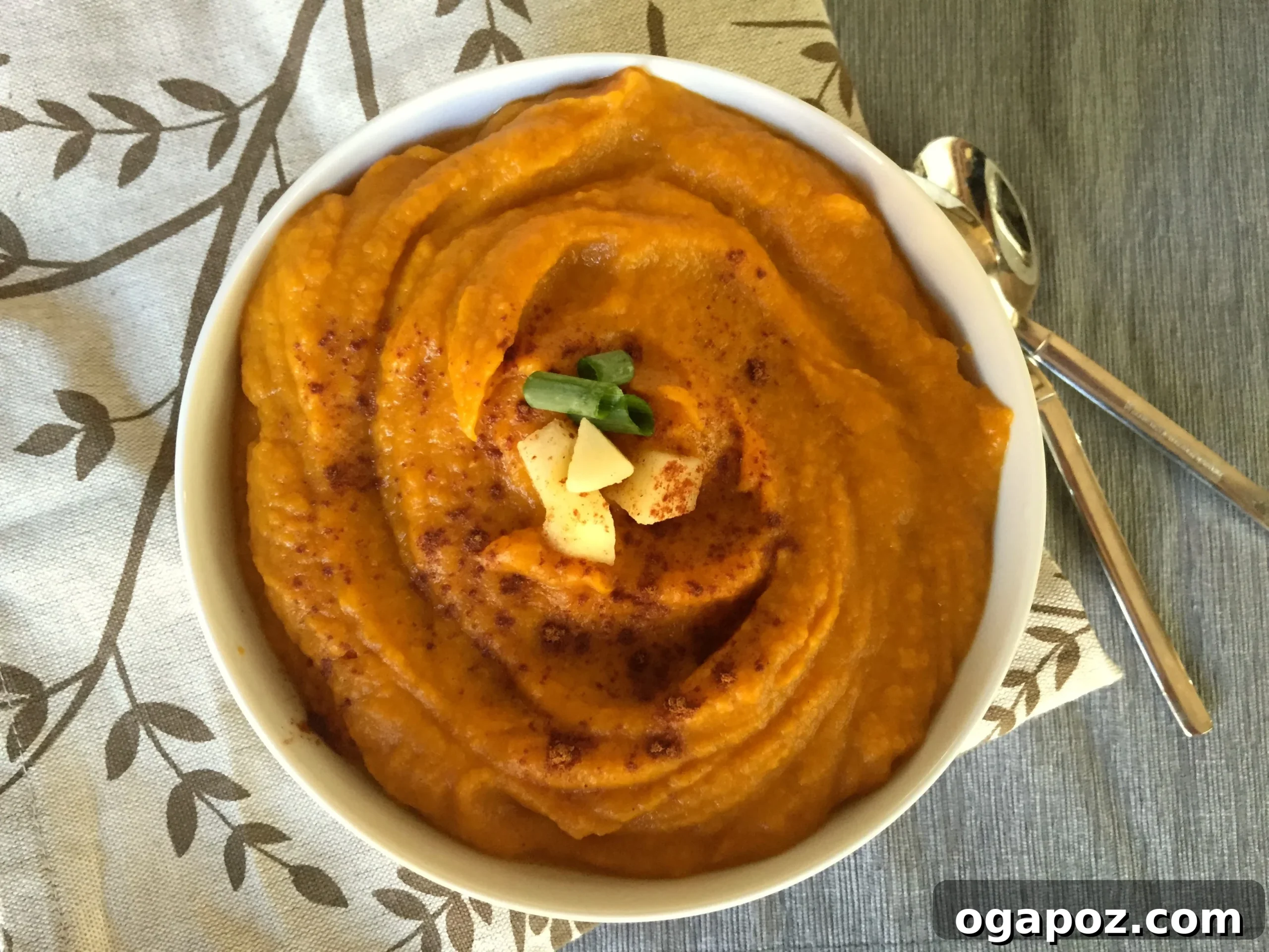 Spiced Harvest Butternut Sweet Potato Apple Soup 4 A large stockpot filled with simmering butternut squash, sweet potato, and apple soup, just before blending, showcasing the rich colors of the ingredients.