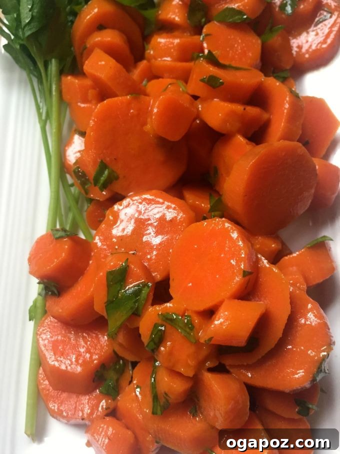 Sweet Glazed Carrots 4 Carrots sautéing in butter in a pan