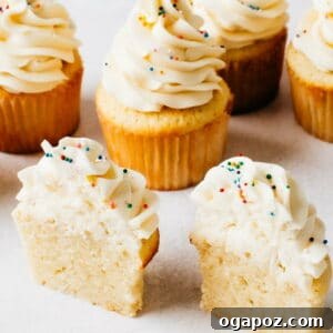 The best vanilla cupcake recipe, topped with frosting and sprinkles.