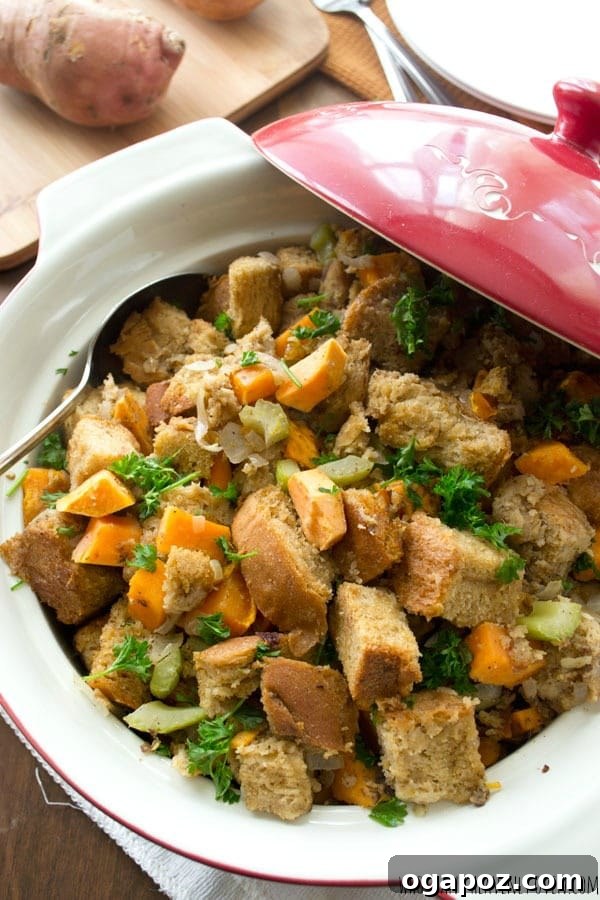 17 Stress-Free Slow Cooker Holiday Meals 5 Comforting Crockpot Sweet Potato Stuffing in a serving dish, ready for a holiday meal.