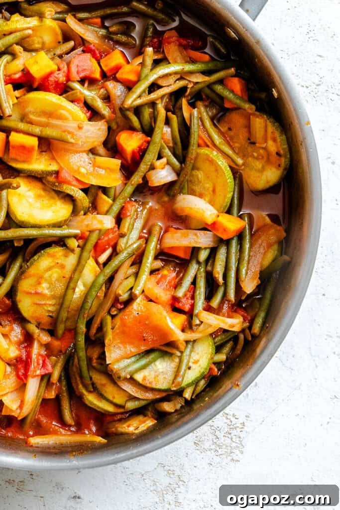 Lebanon's Garden Bounty 7 Lebanese Vegetables simmering in a pan with the lid slightly ajar