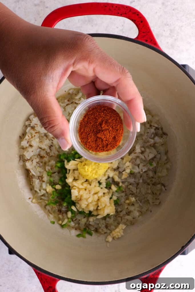 Creamy Madras Lentil Curry 5 adding cayenne powder and the remaining spices