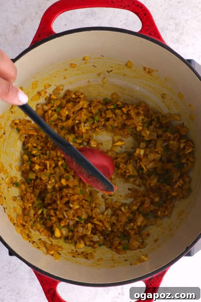 Creamy Madras Lentil Curry 6 adding tomato paste on the spices and aromatics