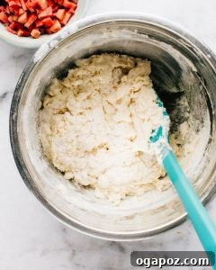 Wholesome Rhubarb Yogurt Muffins 10 Mixing rhubarb muffin batter.