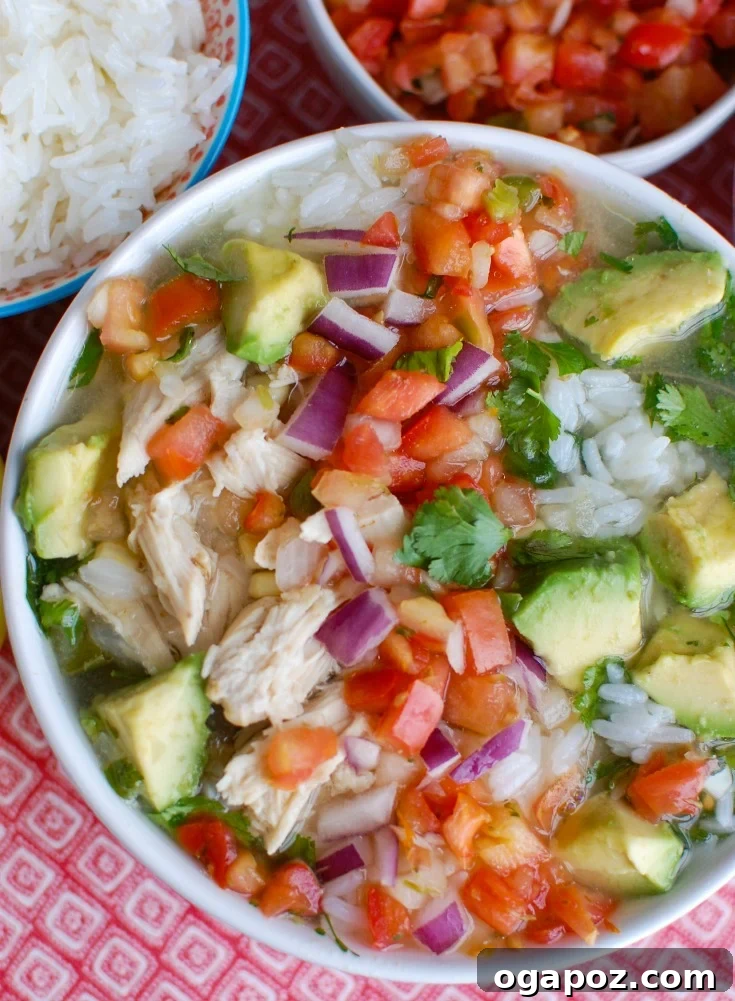 Slow Cooked Fiesta Lime Chicken Soup 3 Slow Cooker Mexican Chicken Lime Soup garnished with creamy avocado slices