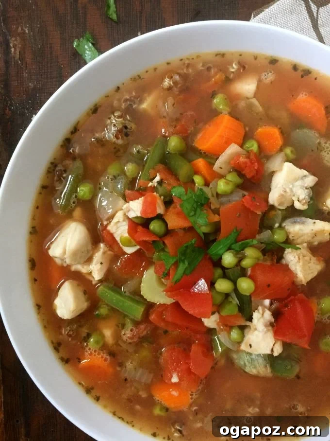 Wholesome Chicken Quinoa Soup 3 Chicken Quinoa Soup served in a bowl, perfect for a cozy dinner.