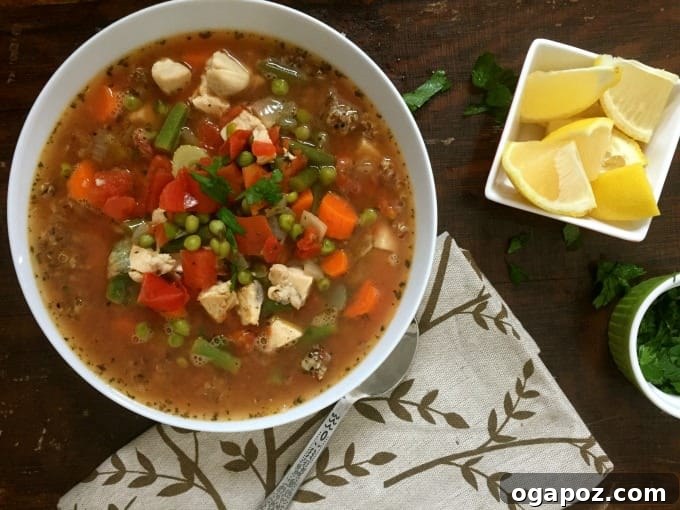 Wholesome Chicken Quinoa Soup 4 Close-up of a bowl of Chicken Quinoa Soup, showcasing its texture and ingredients.