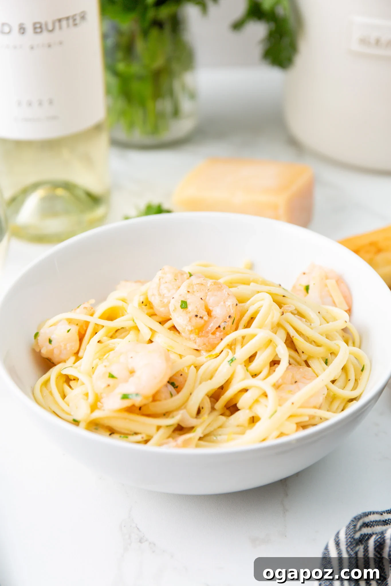 Sun-Kissed Lemon Garlic Shrimp Linguine 2 A vibrant bowl of Lemon Garlic Shrimp Pasta served with a glass of white wine.