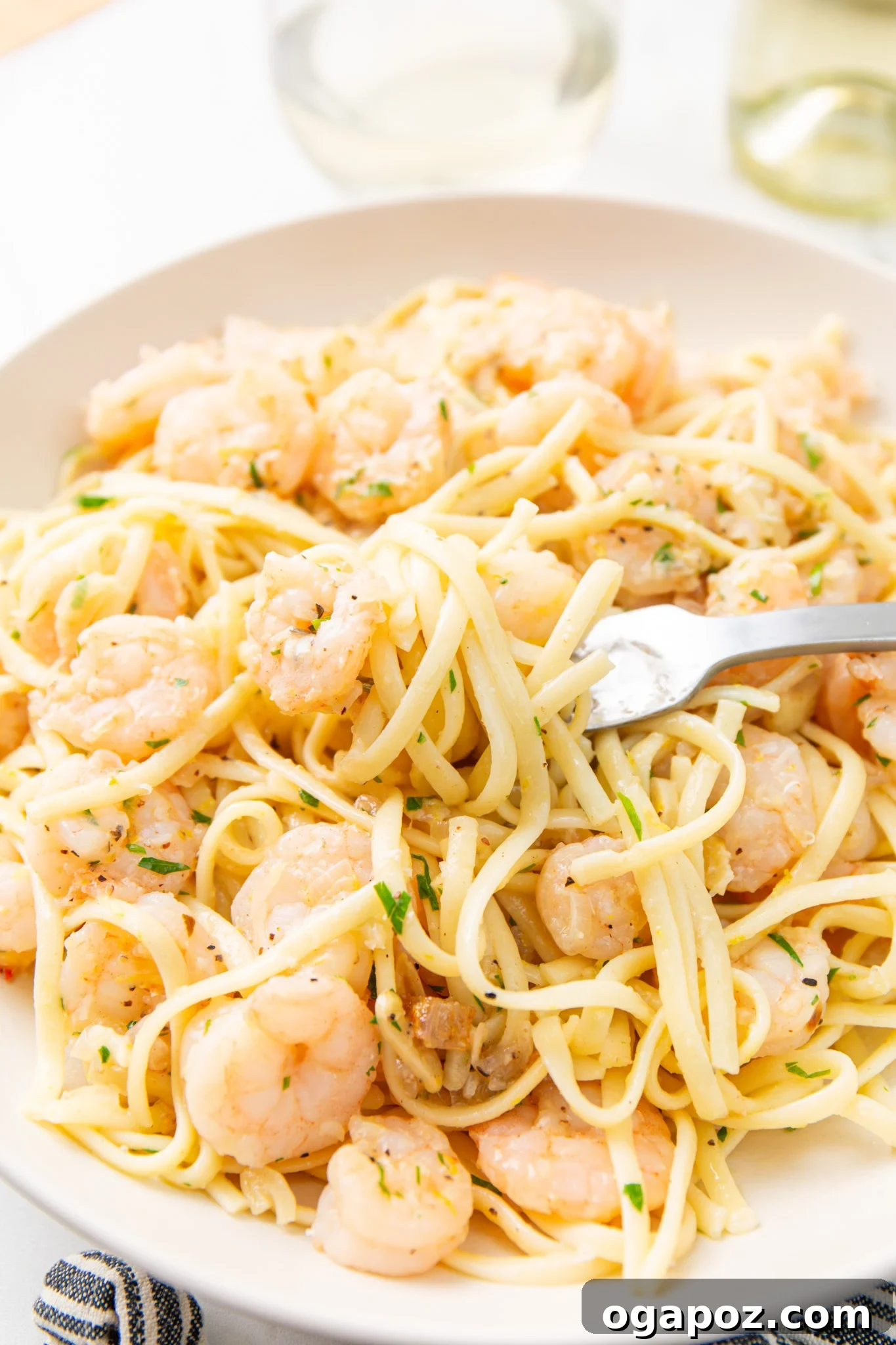 Sun-Kissed Lemon Garlic Shrimp Linguine 3 Close-up of Lemon Garlic Shrimp Pasta with a fork twirled into the noodles.