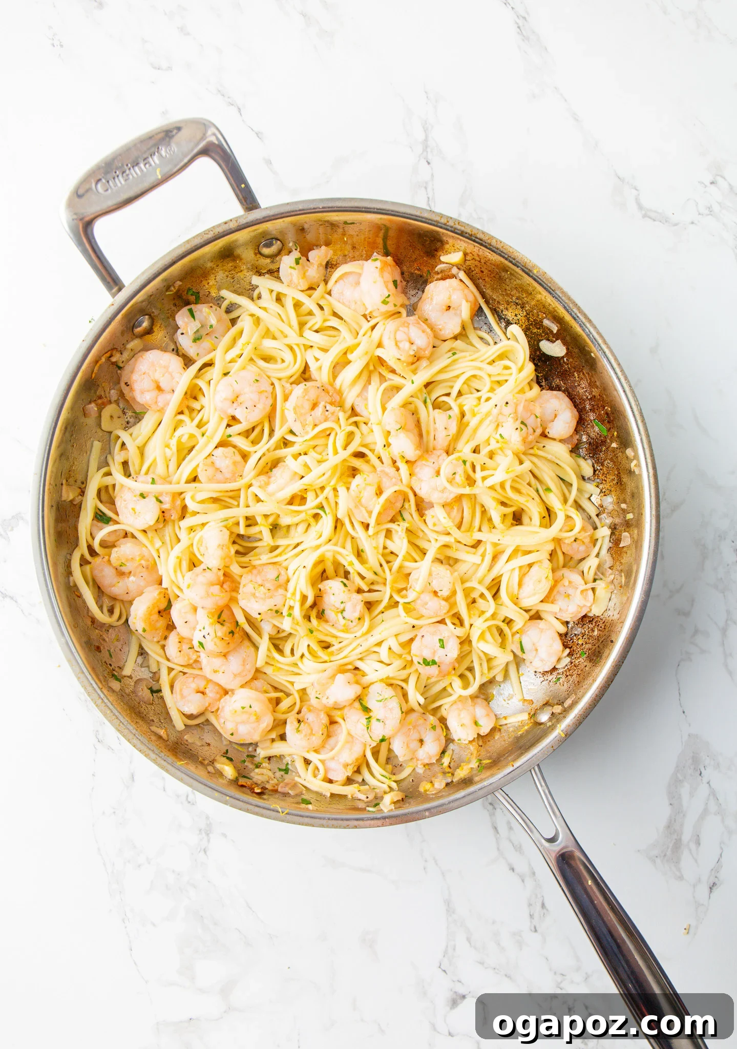 Sun-Kissed Lemon Garlic Shrimp Linguine 10 Lemon Garlic Shrimp Pasta simmering in a skillet, ready to be served.