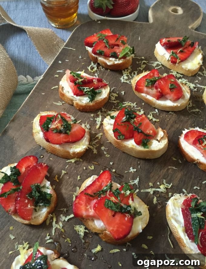 Fresh Strawberry Mint Mascarpone Crostini with Lemon Honey Drizzle 2 Delicious Strawberry Mint Crostini with Lemon Honey Drizzle on a serving platter