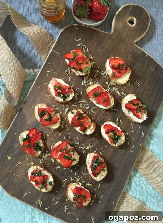 Fresh Strawberry Mint Mascarpone Crostini with Lemon Honey Drizzle 7 Close-up of a single Strawberry Mint Mascarpone Crostini, highlighting the texture and topping