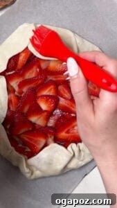 Egg wash on strawberry tart.