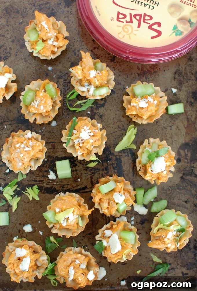 Tangy Buffalo Chicken Hummus Poppers 5 Platter of Buffalo Chicken Hummus Bites, showcasing their appealing presentation for a party.
