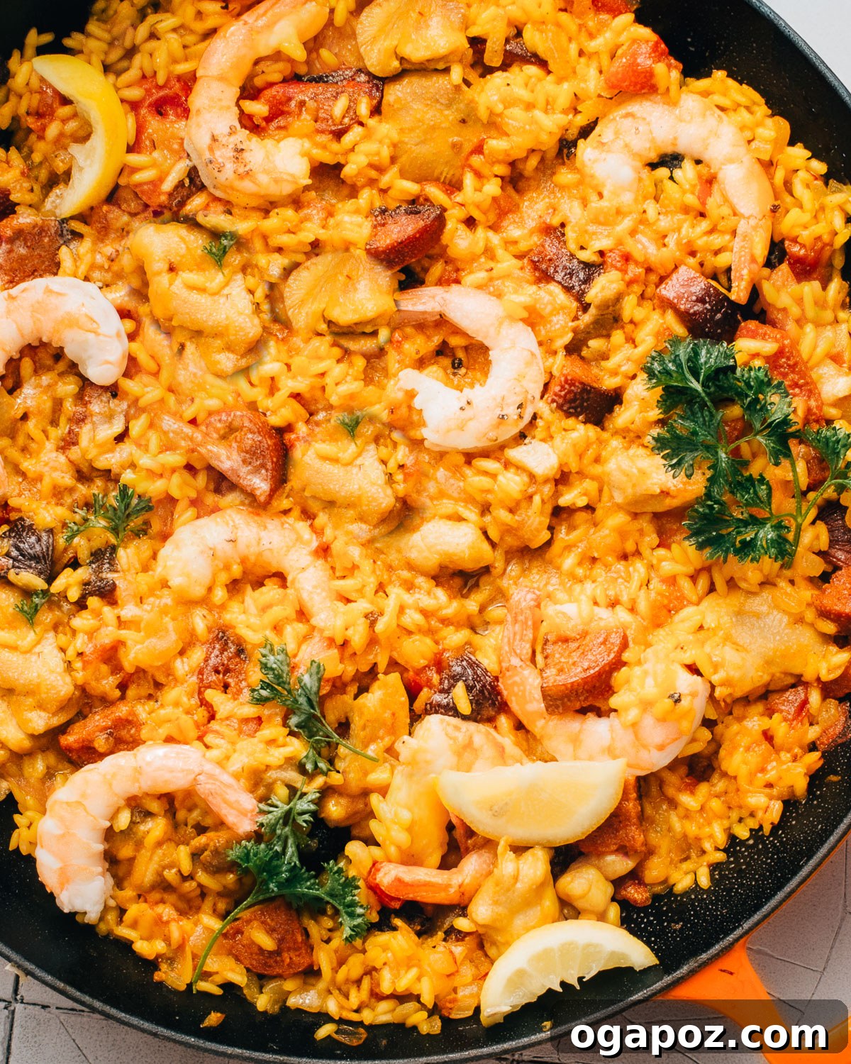 Spanish Surf and Turf Paella 2 A vibrant Chorizo Paella with shrimp, chicken, and lemon slices, ready to be served.
